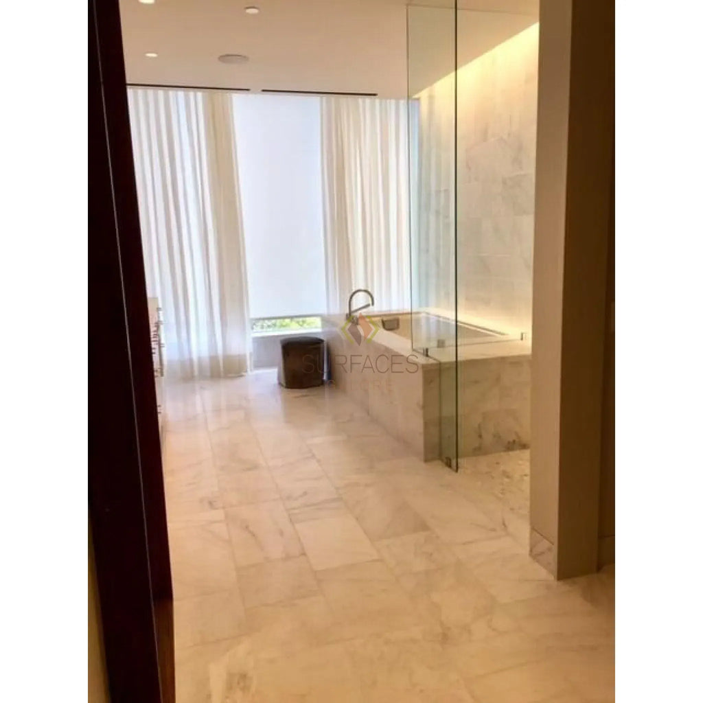 Marble-clad bathtub with glass enclosure in Oriental White and Black Marble Mosaic