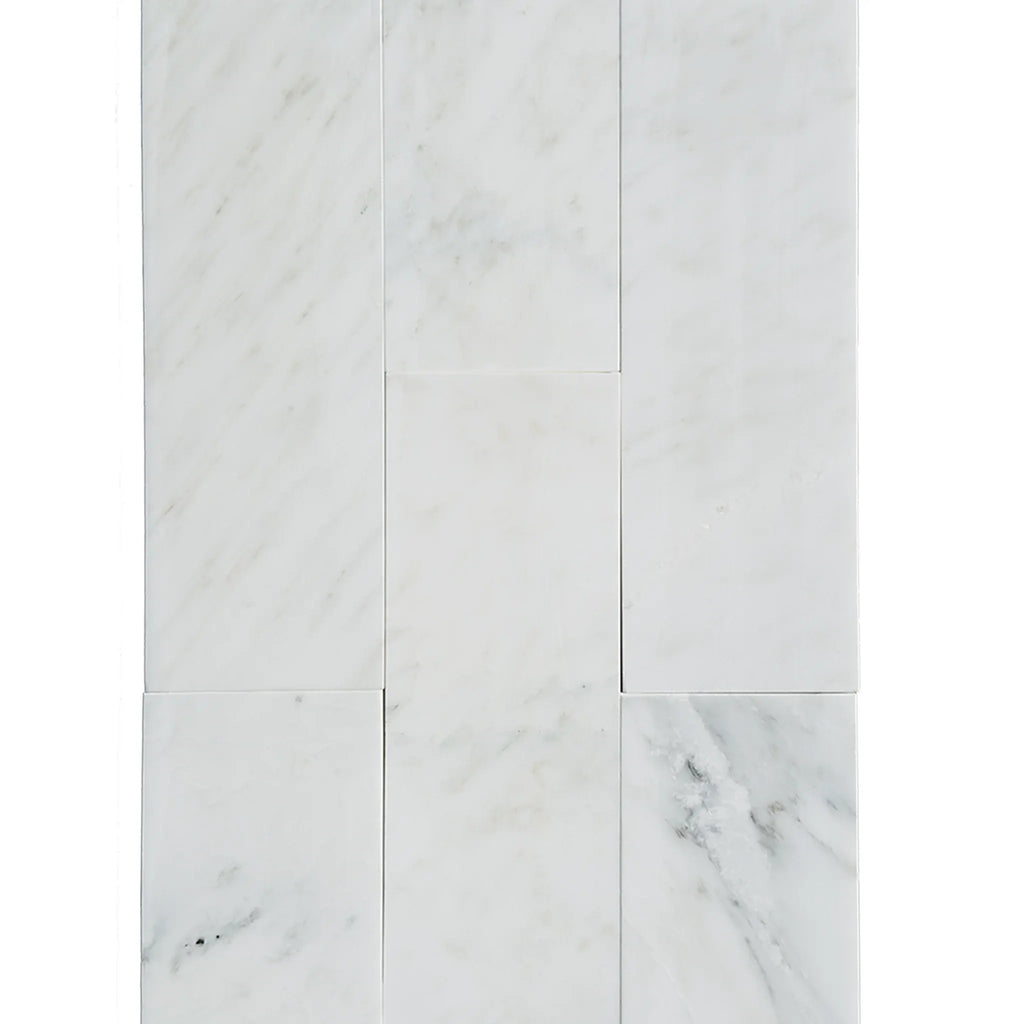 White marble tile arrangement of Oriental White Asian Statuary Marble 4X12 polished finish