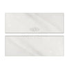 Two light-colored rectangular tiles of Oriental White Asian Statuary Marble 4X12