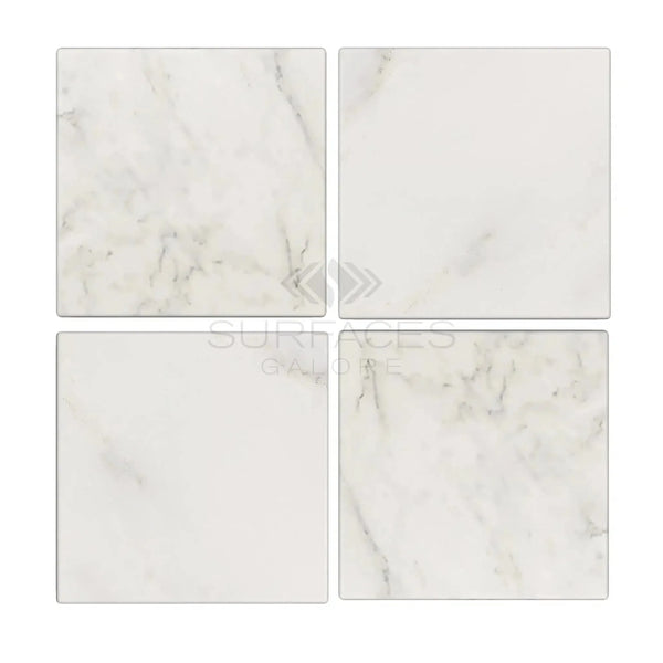 Four square marble tiles of Oriental White Asian Statuary Marble 4X4 Tumbled