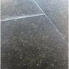 Black speckled floor tiles in Pierre Bleue 12X24 Brushed Marble design