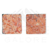 Two square reddish-brown textured coasters made from Rosso Verona Marble