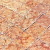 Square reddish-brown Rosso Verona marble tiles displayed in 4X4 tumbled style