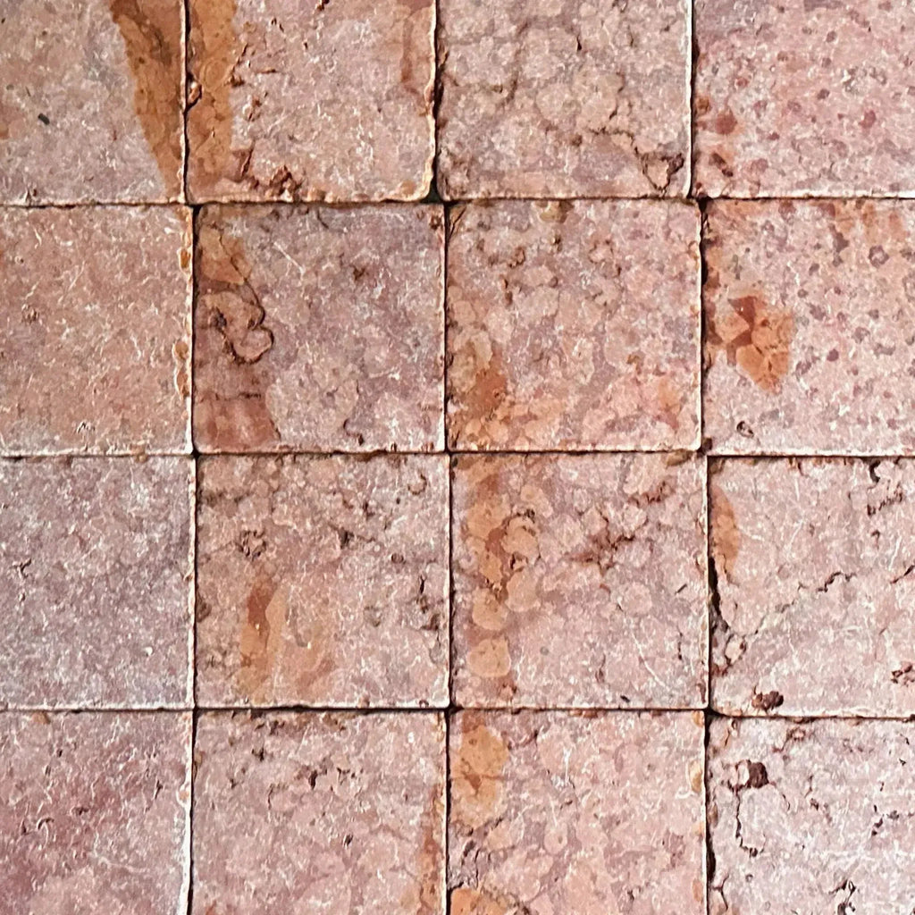 Square, textured reddish-brown tiles from Rosso Verona Red Marble 6X6 Tumbled Tile