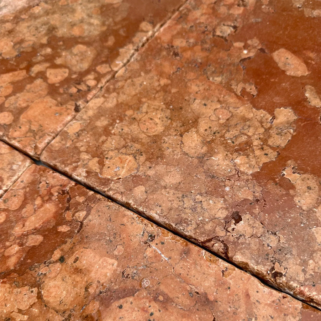 Textured reddish-brown floor tiles of Rosso Verona Marble 12X12 Tumbled