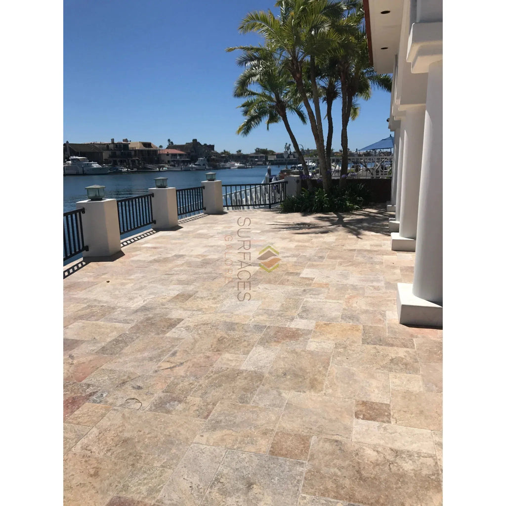 Scabos Travertine outdoor patio featuring honed double-step chair rail trim liner