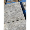 Gray marble tiles of Silver Gray Travertine 1/2X12 Pencil Liner Honed product display