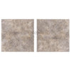 Two square concrete tiles of Silver Gray Travertine 16X16 Unfilled Brushed and Chiseled Edge