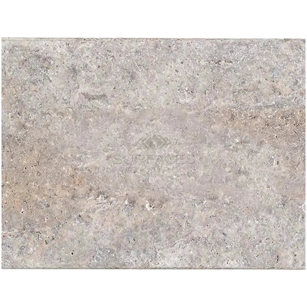 Textured gray stone slab of Silver Gray Travertine 16X24 Tile Tumbled