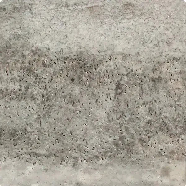 Porous gray travertine tile from the Silver Gray Travertine 18X18 Tumbled product