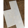 White L-shaped tile from Snow White 1/2X12 Pencil Liner Marble Polished collection