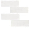 Rectangular white tiles of Snow White Marble 2X8 Polished showcasing elegant design