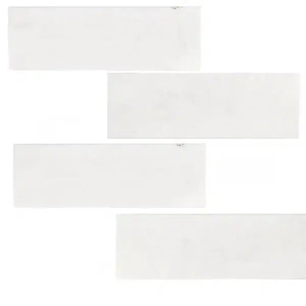 Rectangular white tiles of Snow White Marble 2X8 Polished showcasing elegant design