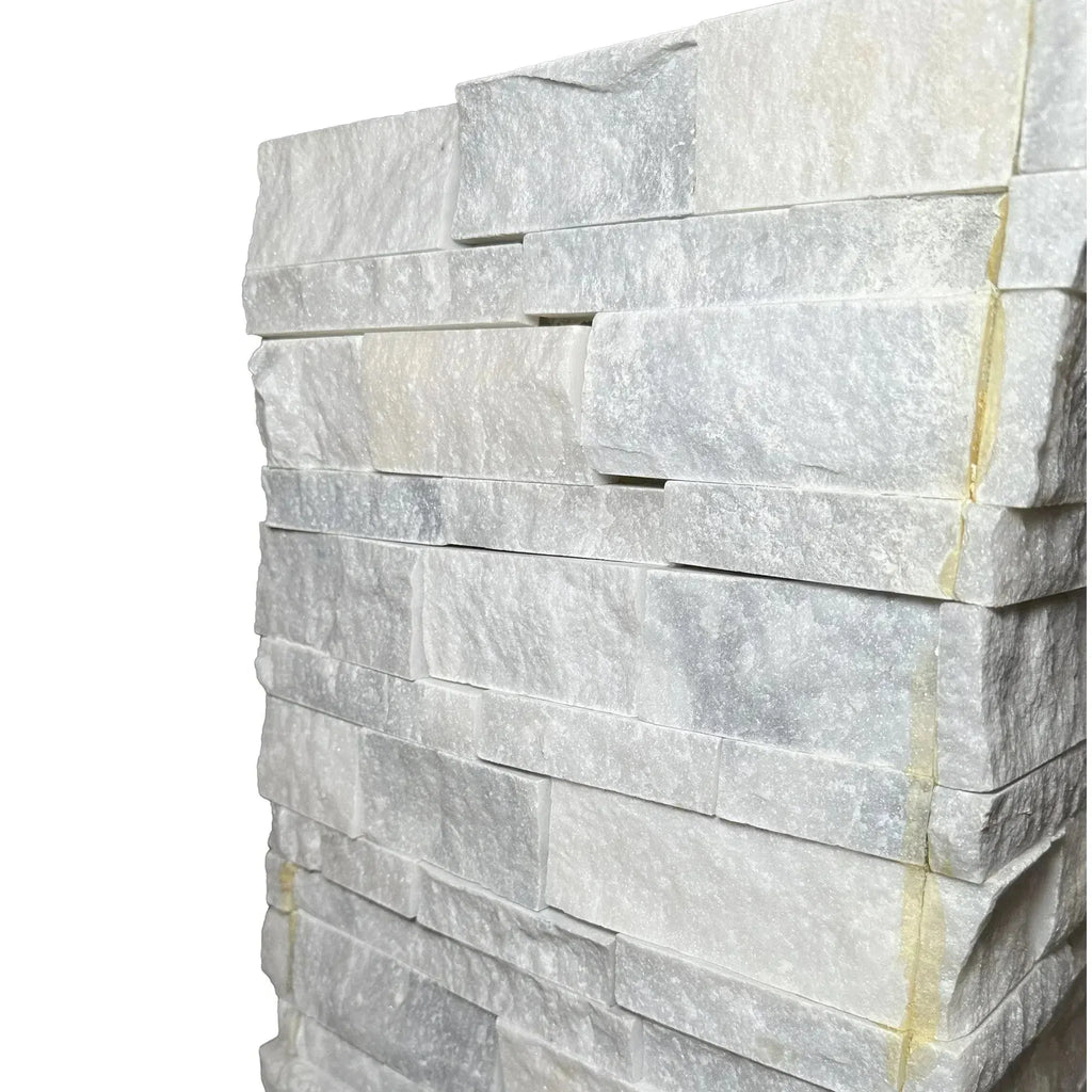 Stacked white stone wall tiles from Split-Face Panel Travertine Set on clearance sale