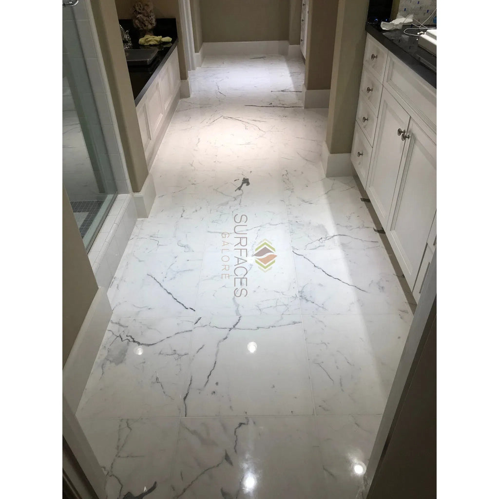 Statuary-Statuario White Italian Marble floor featuring dark veining in polished finish