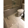 White toilet with closed lid in Statuary Statuario White Italian marble setting