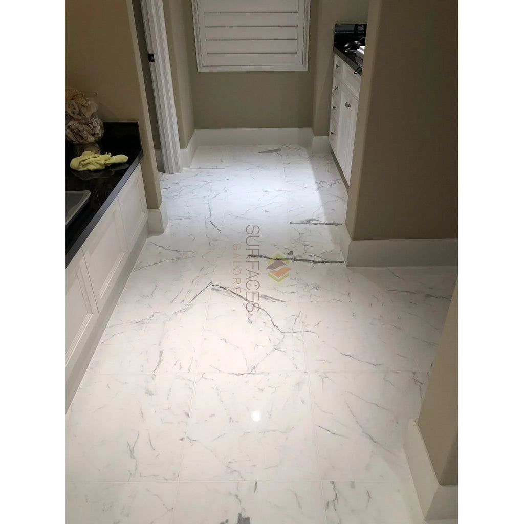 White marble-patterned floor tiles in Statuary-Statuario White 12X24 Italian Marble