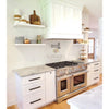 Elegant White Kitchen Featuring Thassos White Marble Pencil Liner and Stainless Steel Range