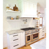 Elegant white kitchen featuring Thassos White 18X18 Marble with stainless steel range