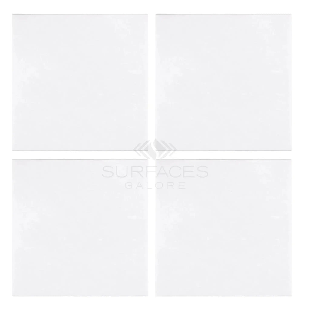 Four white square Thassos White 18X18 Marble Polished or Honed tiles arranged together