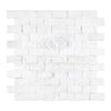 Thassos White 1X2 Brick Mosaic Marble Split-Faced on a white brick wall panel