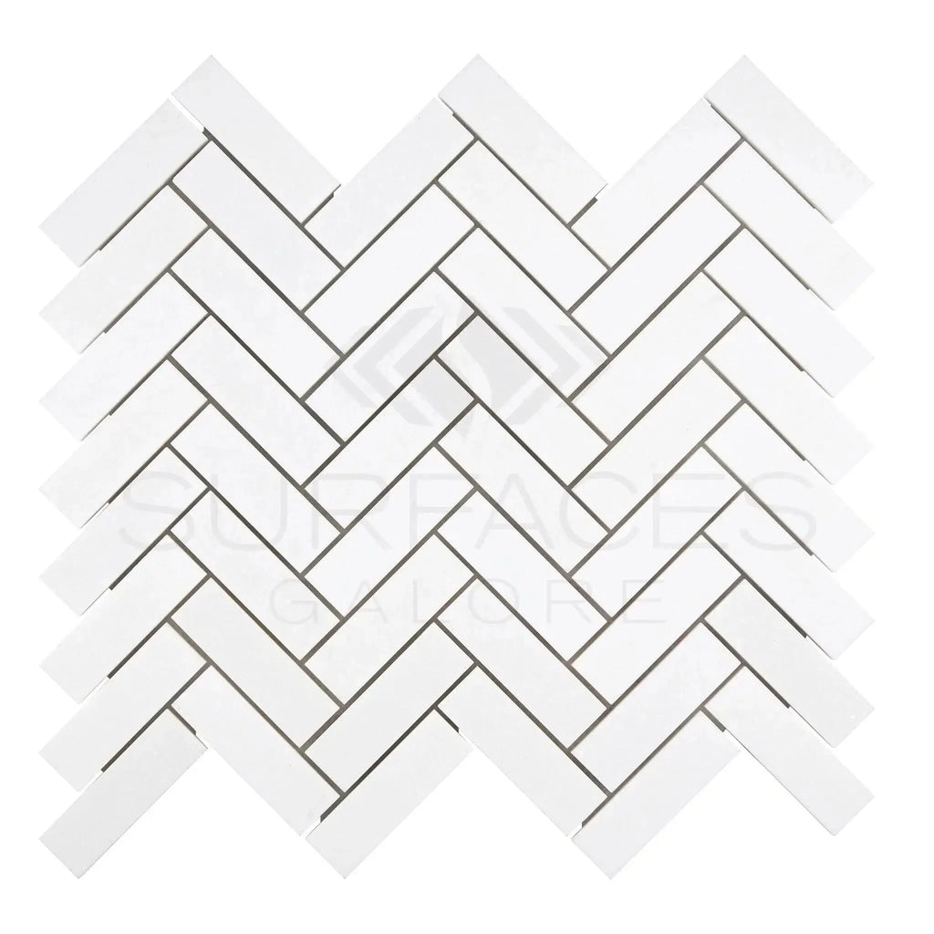 Thassos White 1X3 Herringbone Mosaic Marble Polished or Honed in a white tile pattern