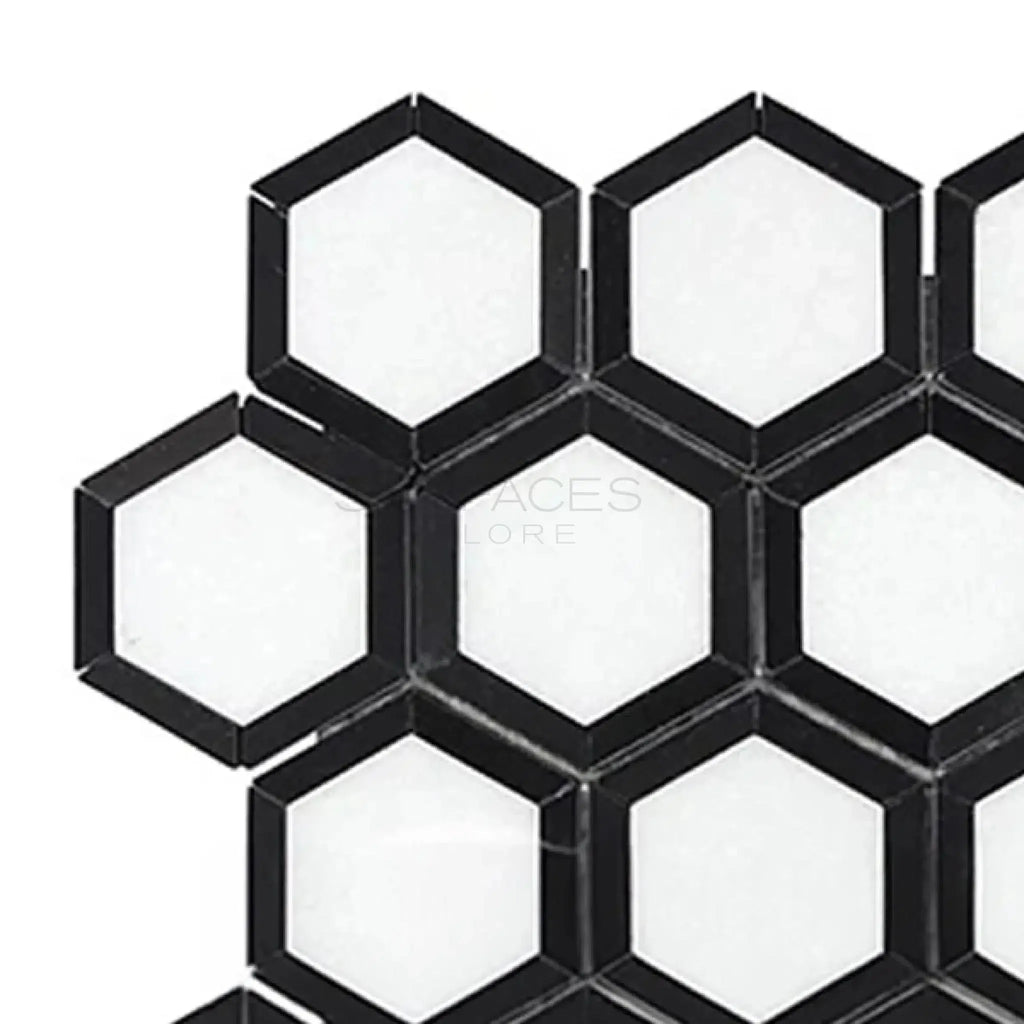 Hexagonal black and white tile pattern of Thassos White 2 inch Vortex Hexagon Mosaic