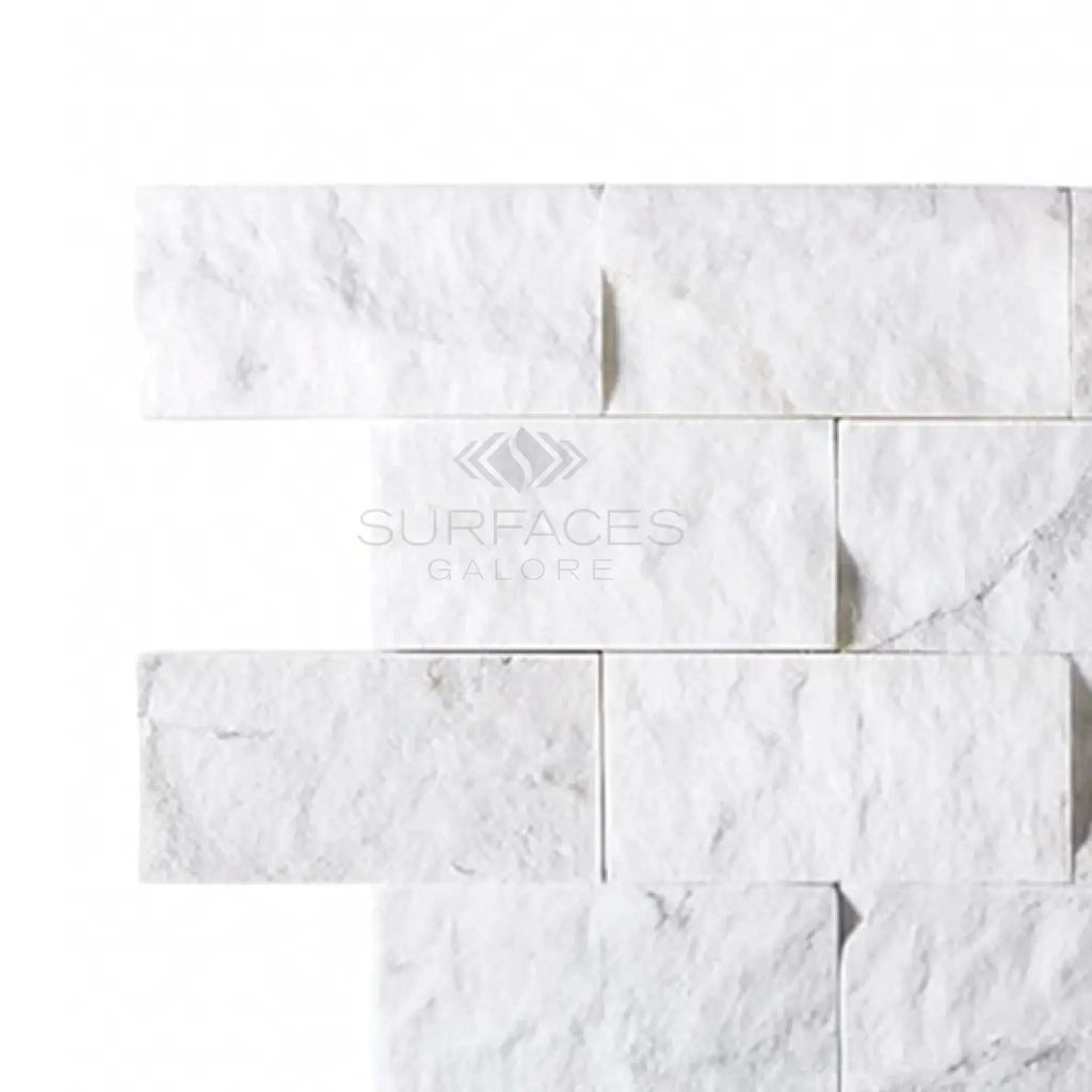 Thassos White 2X4 Brick Mosaic Marble Split-Faced on a white marble brick wall