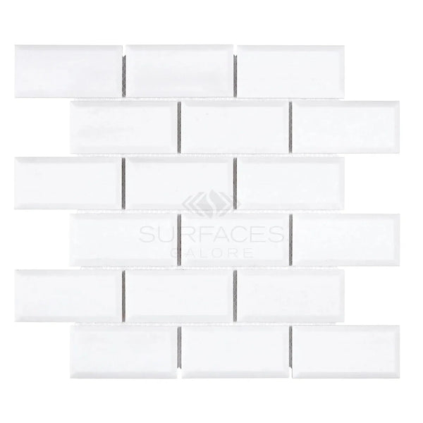 White glass subway tile in Thassos White 2X4 Deep-Beveled Brick Mosaic Marble design