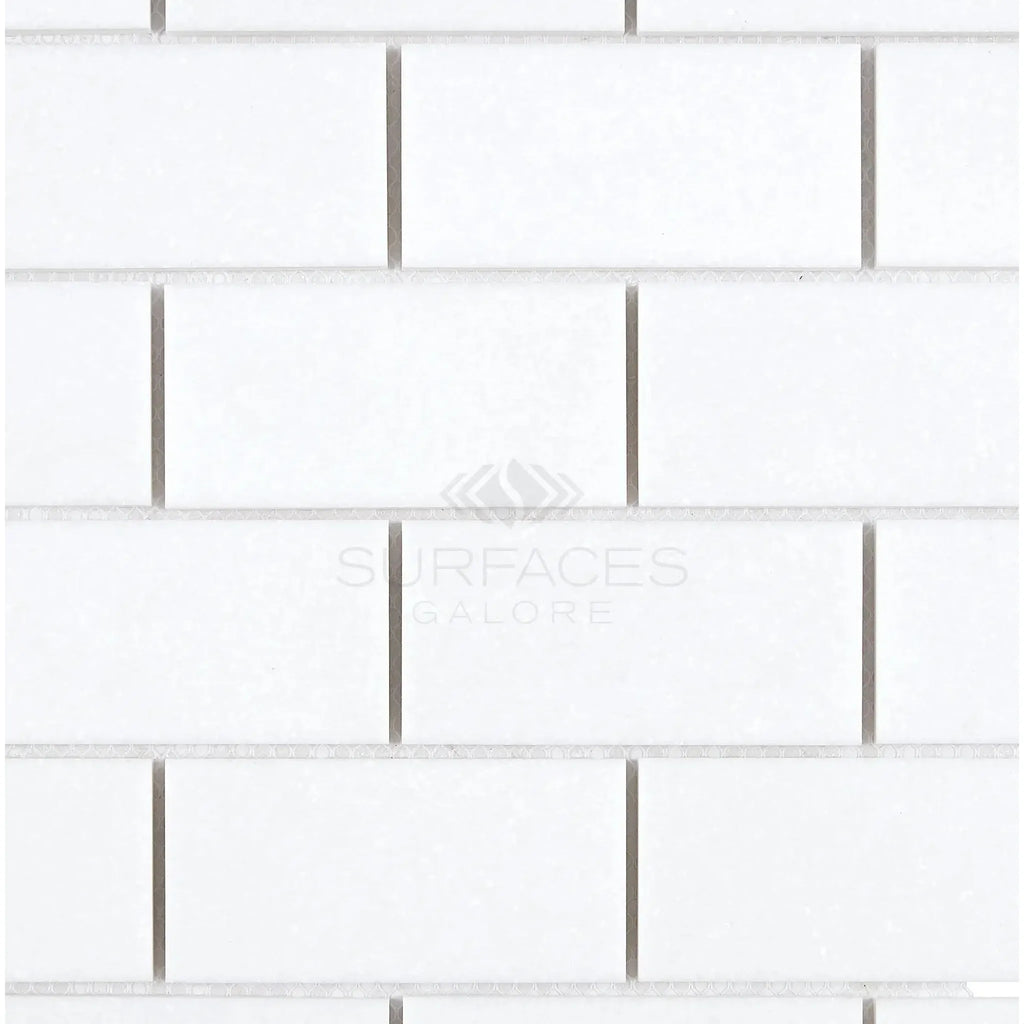 White subway tile pattern featuring Thassos White 2X4 Straight-Edged Brick Mosaic Marble