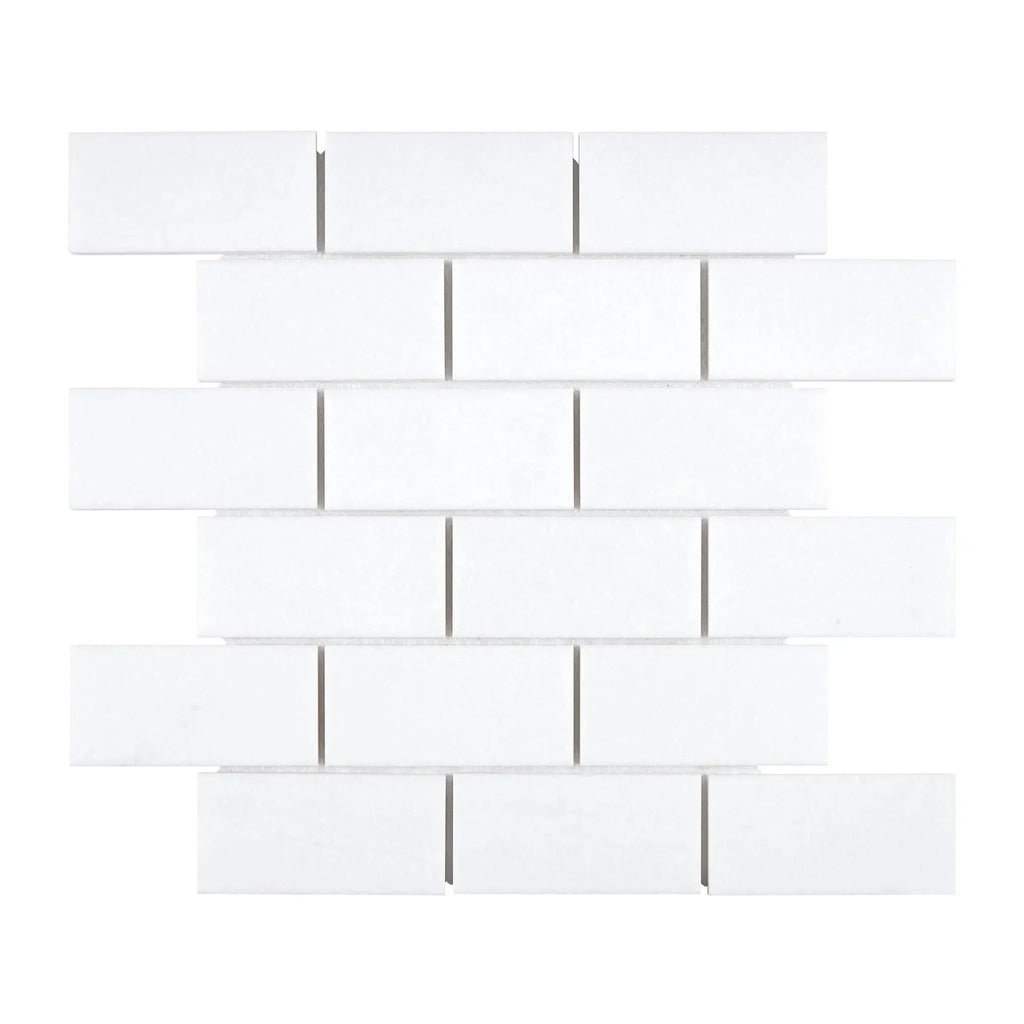 Thassos White 2X4 Straight-Edged Brick Mosaic Marble in a classic white subway tile pattern