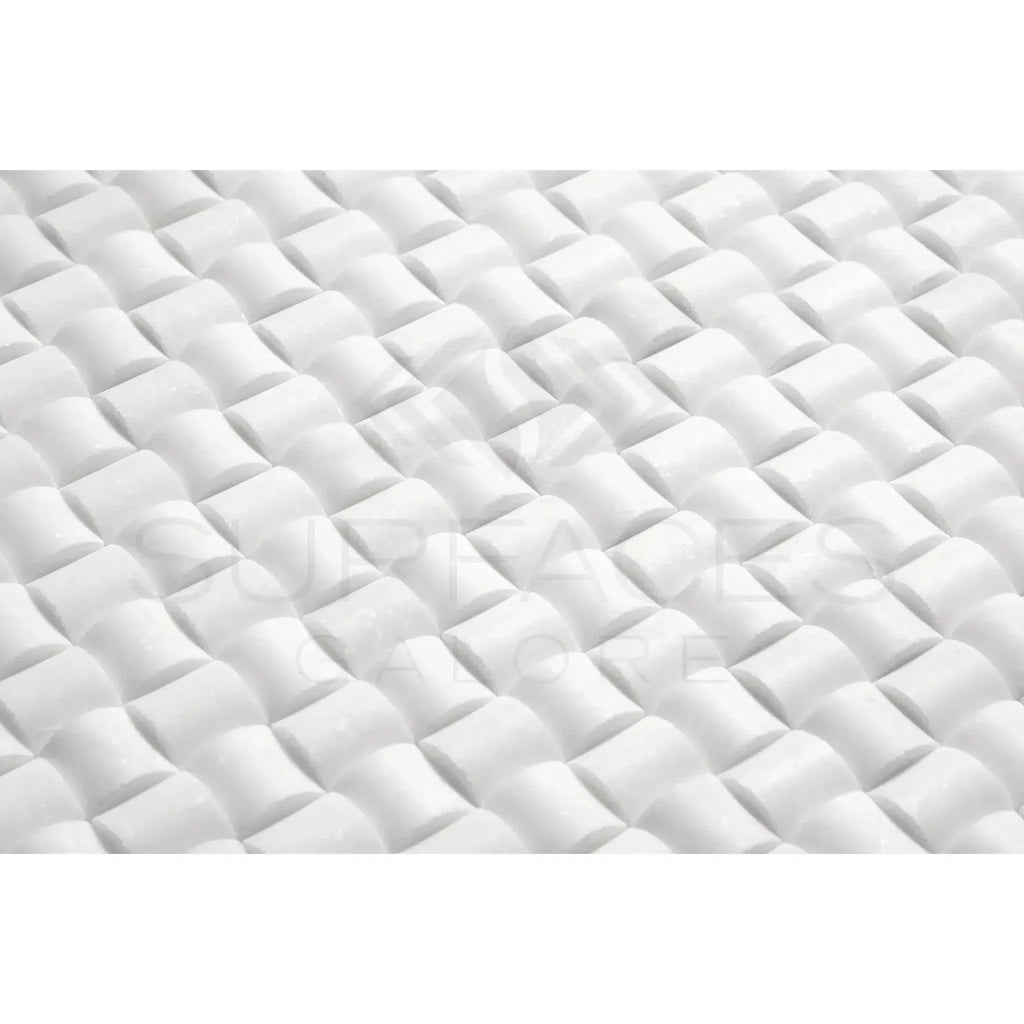 White quilted mattress topper displayed on Thassos White 3-D small-bread mosaic marble