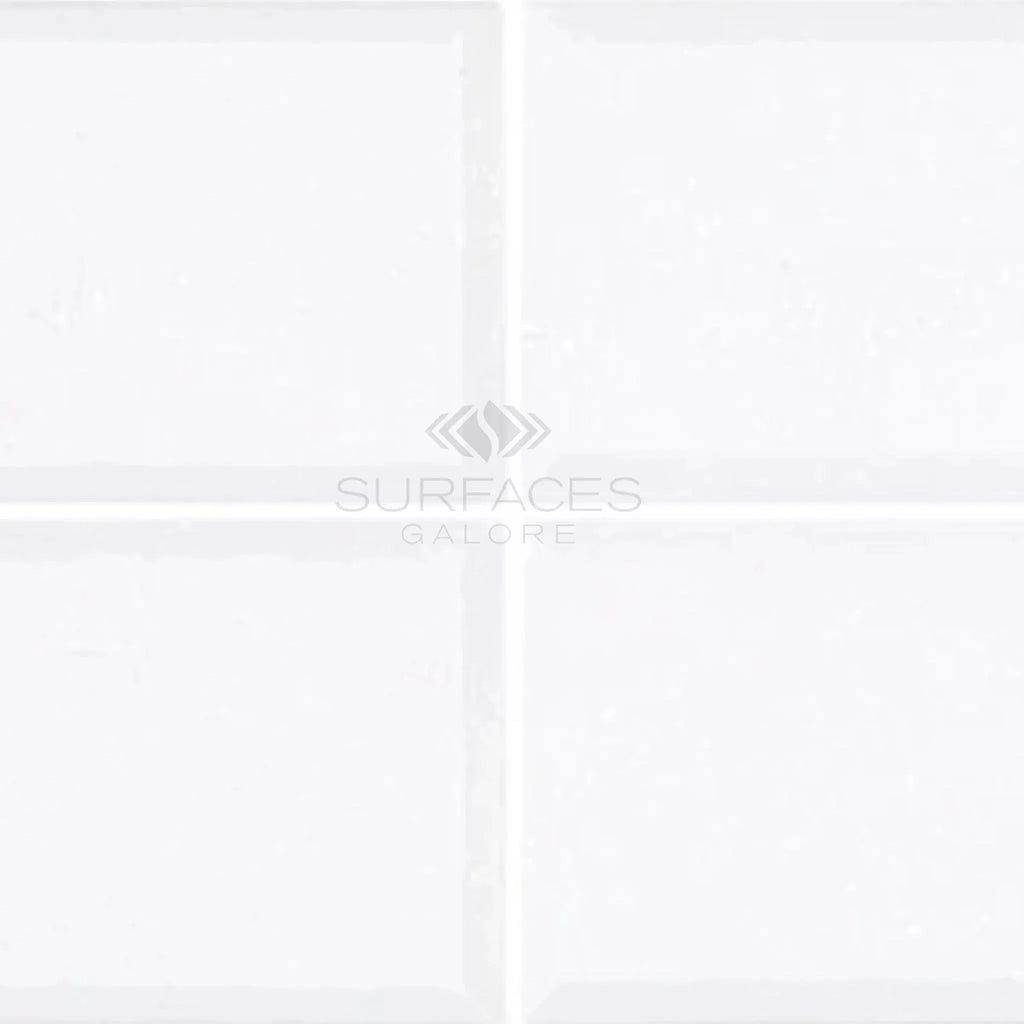 White beveled square tiles from Thassos White 3X6 Deep-Beveled Marble Polished-Honed