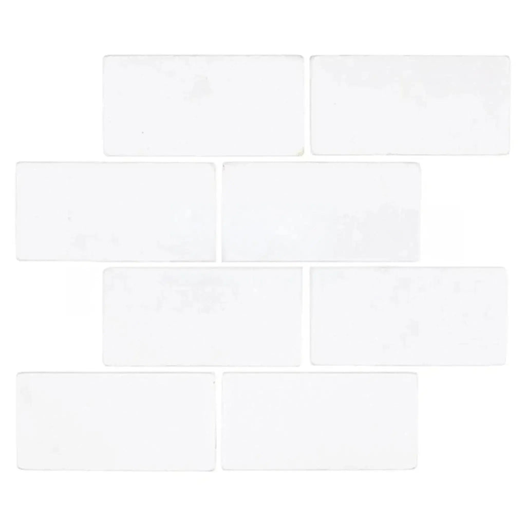 White rectangular tiles in Thassos White 3X6 Marble Tumbled for elegant decor