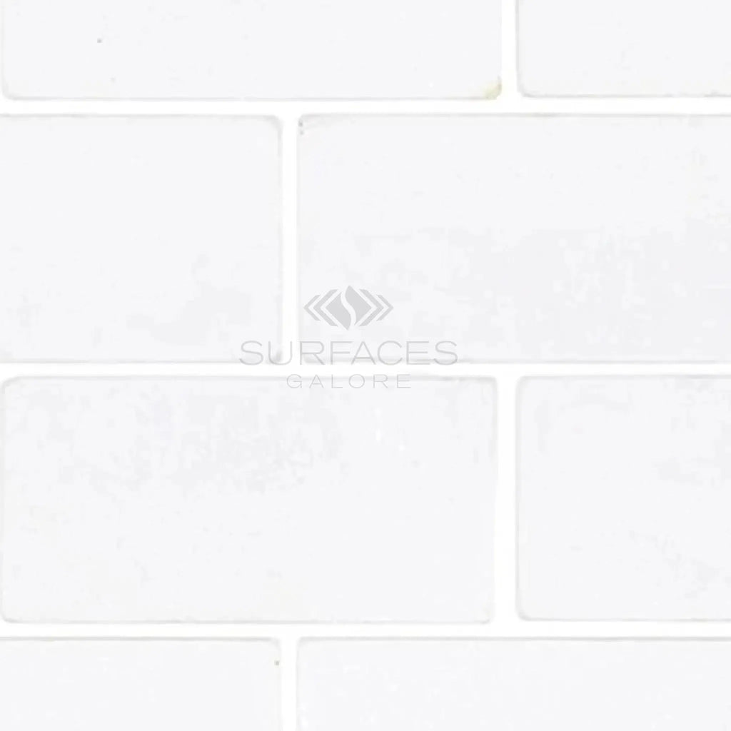 Thassos White 3X6 Marble Tumbled featuring a sleek white rectangular tile pattern