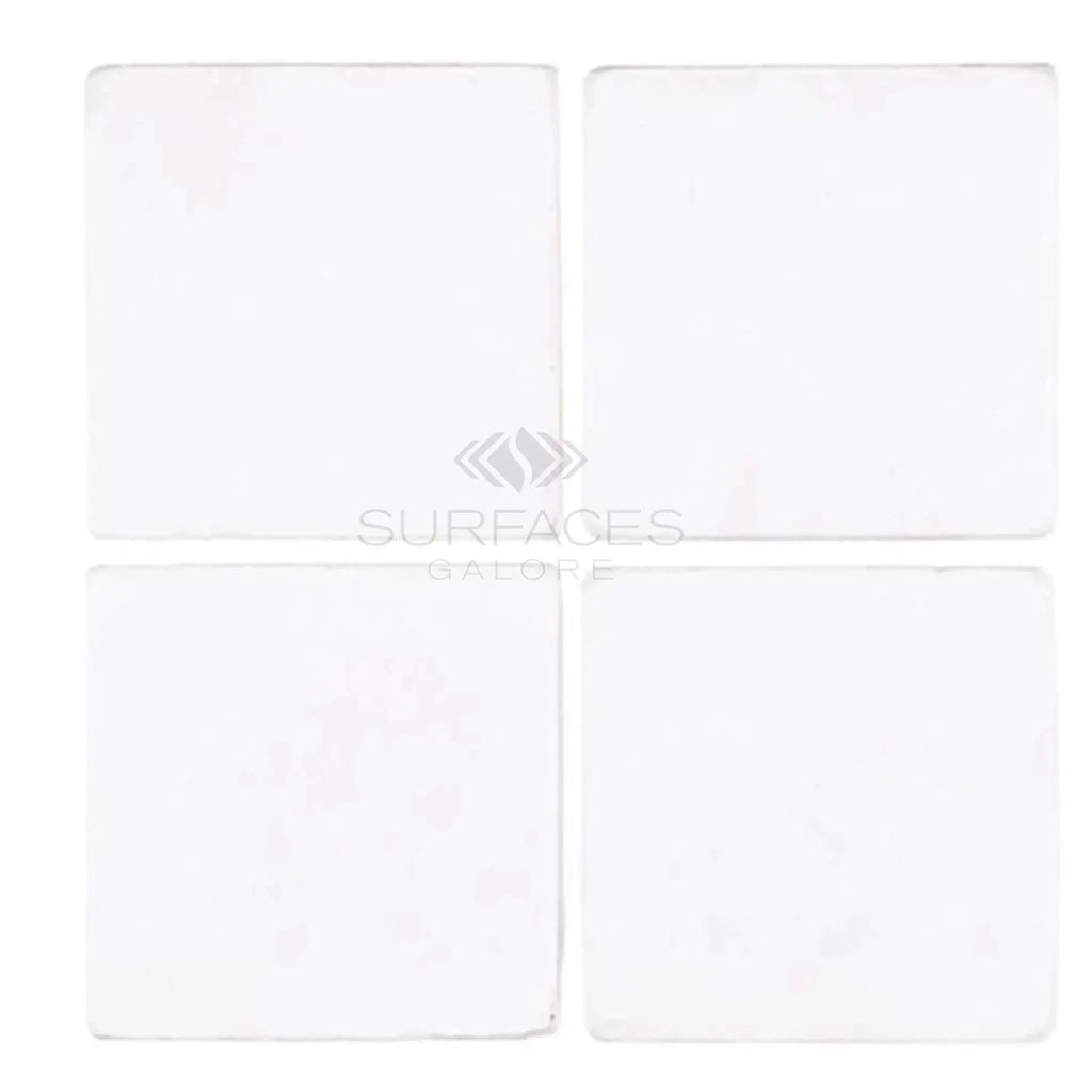 Thassos White 4X4 Marble Tumbled featuring four elegant white square tiles