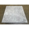 Square gray marble tile from the Tundra Gray 1/2X12 Pencil Liner collection