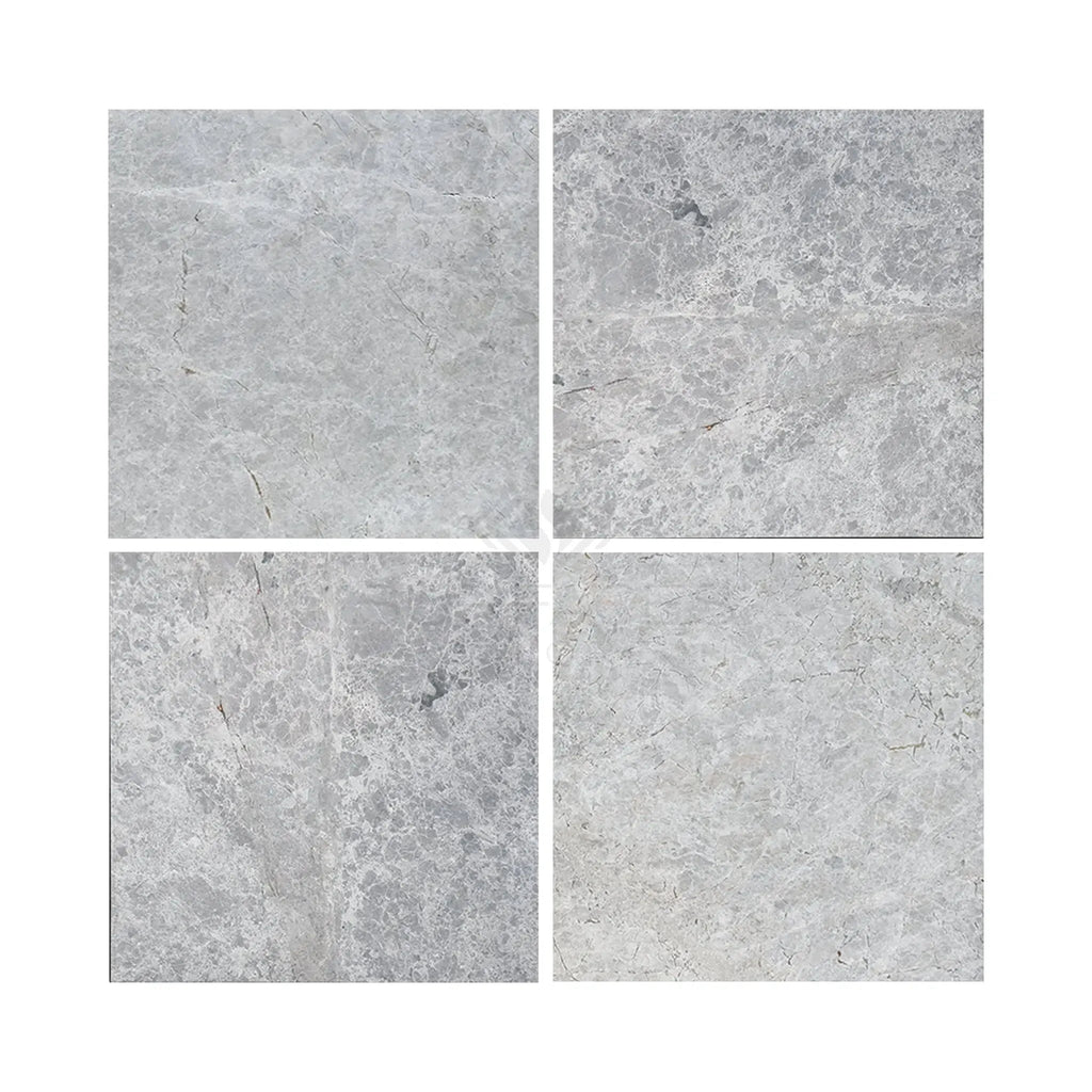 Four gray marble tiles of Tundra Gray 24X24 Marble Polished or Honed