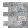 Gray stacked stone wall featuring Tundra Gray 2X4 Marble Mosaic Split-Faced design