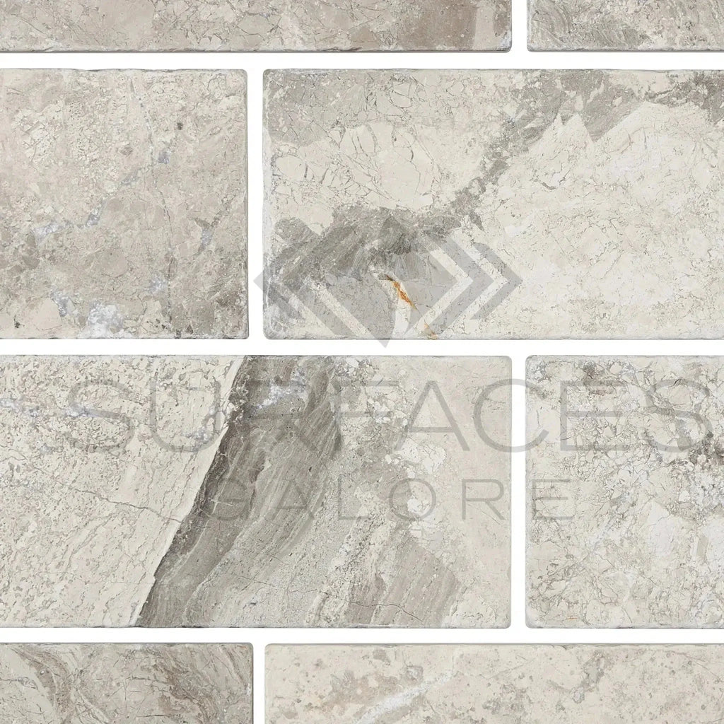 Rectangular Tundra Gray 3X6 Marble Tumbled tiles showcasing elegant natural stone