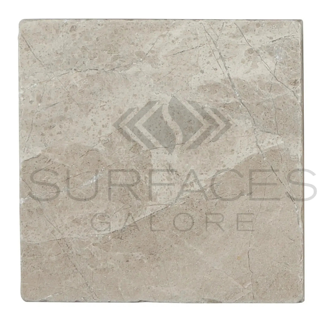 Square Tundra Gray 4X4 Marble Tumbled tile showcasing elegant natural stone texture