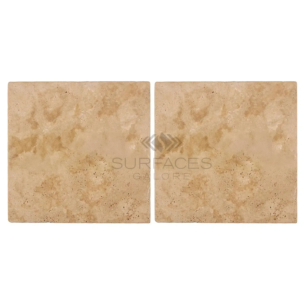 Two beige travertine tiles from Walnut Travertine 24X24 paver tumbled collection