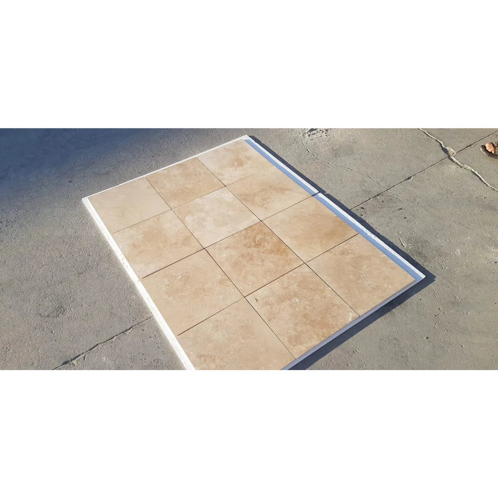 Tiled square platform featuring Walnut Travertine 3/4X12 Bullnose Liner design