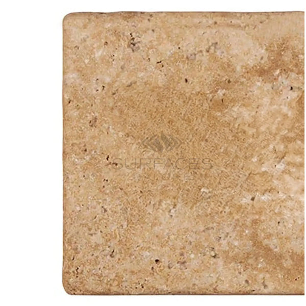 Walnut Travertine 6X12 Tumbled tile showcasing its natural porous texture