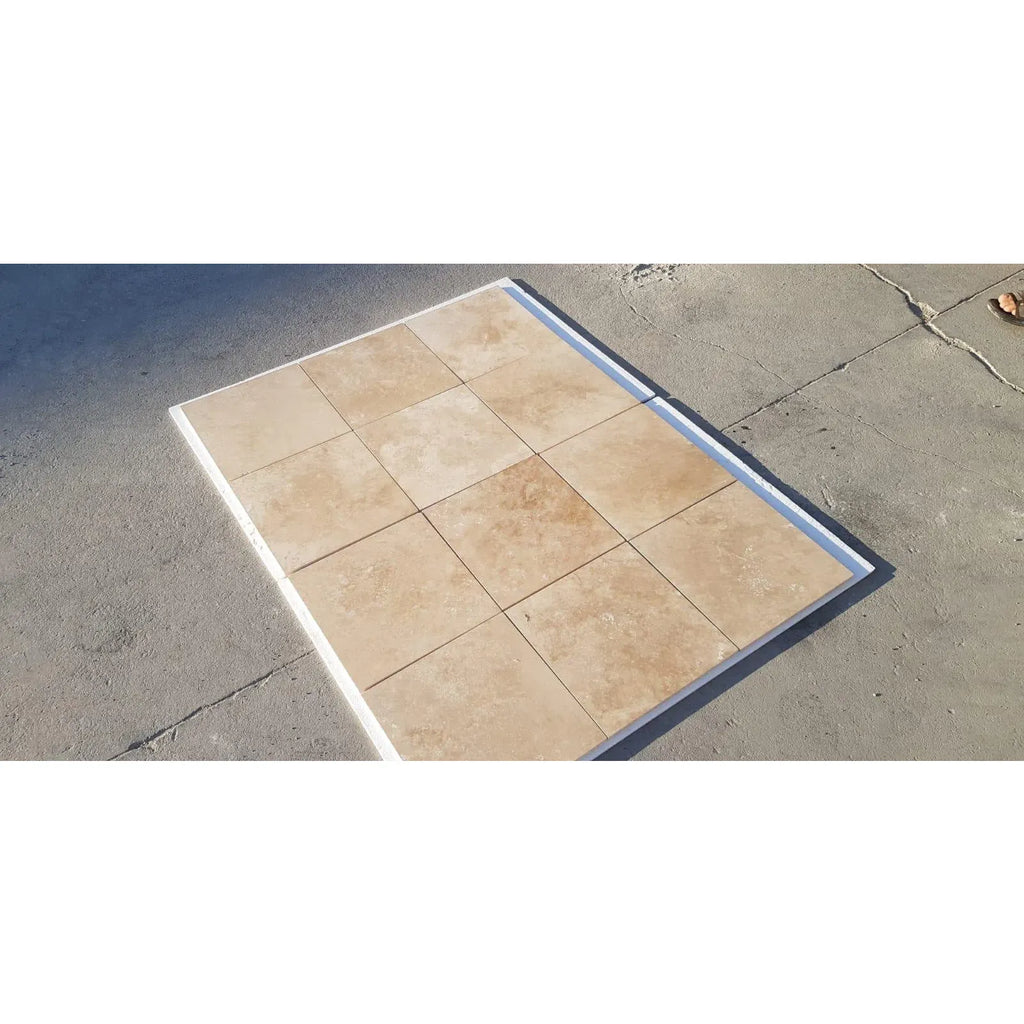 Square tile flooring featuring Walnut Travertine in a Double Toggle Rocker Switch Wall Plate