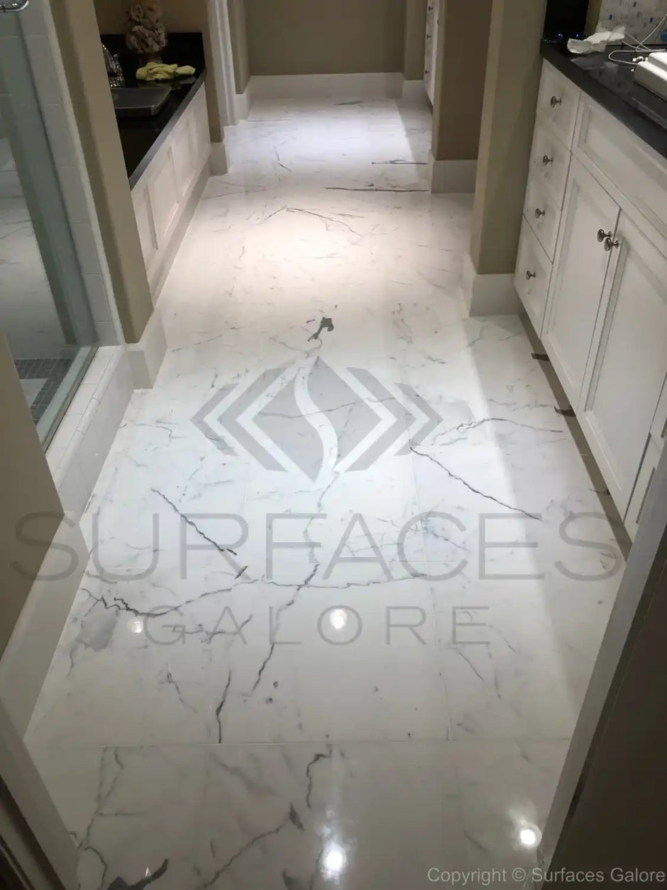 Installed marble and travertine tiles in various spaces like kitchen, bathroom, and living room, showcasing elegant and durable natural stone surfaces