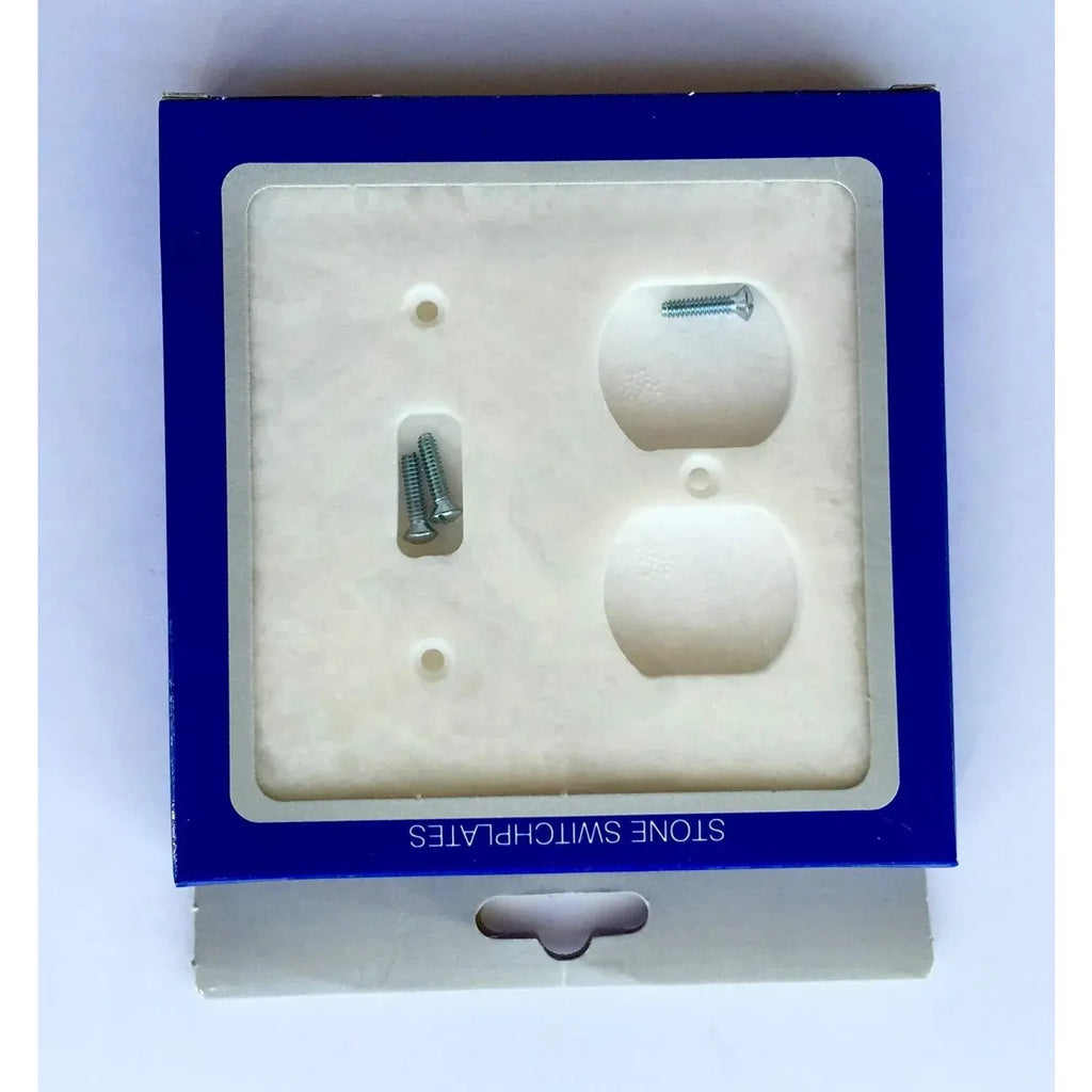 Stone-look outlet cover in packaging for White Marble Meram Blanc Toggle Duplex Wall Plate