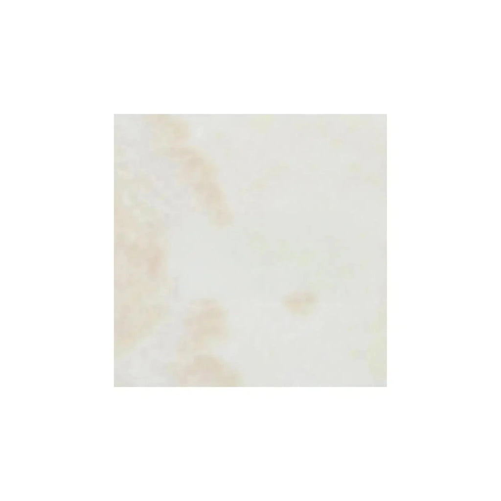 Square tile featuring beige marbling from White Onyx Bianco-Vanilla Cross-Cut marble