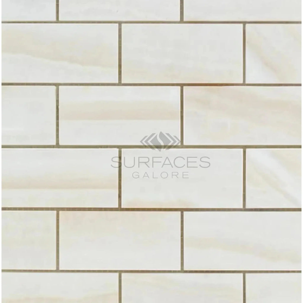 Rectangular cream-colored tile pattern of White Onyx Vein-Cut 2X4 Mosaic Marble Polished