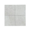 Four light gray stone tiles from White Pearl Botticino Beige Marble collection